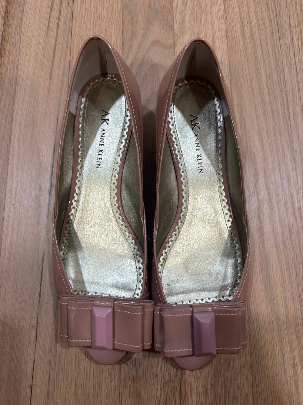 Anne Klein peep-toe wedge pumps in a taupe patent leather finish